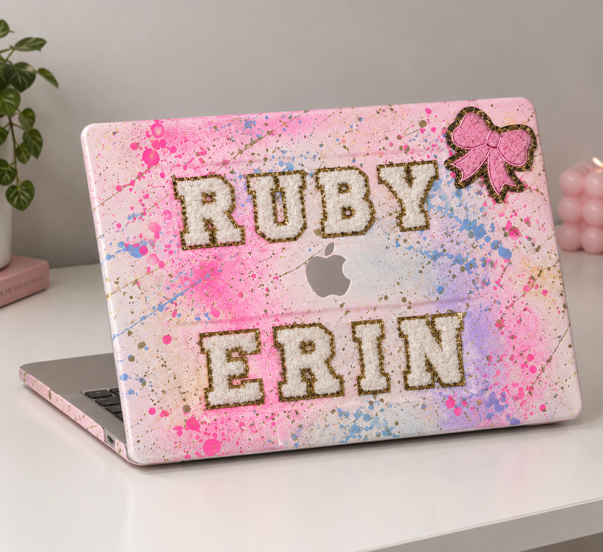 Spray painted Apple Mac covers ( max 6 letters )