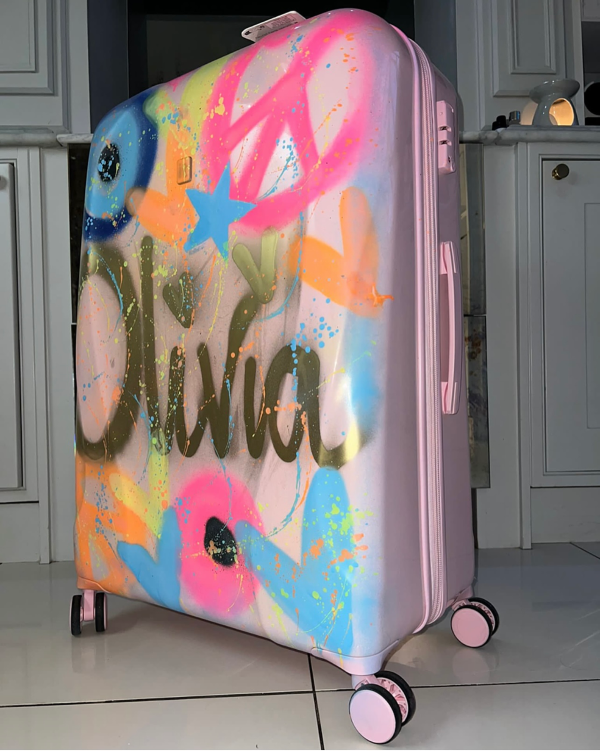 Large pink spray painted  suitcases 💗😍
